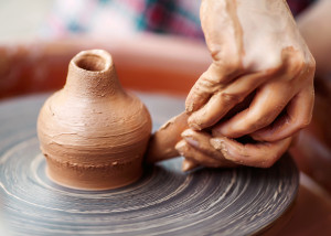 Potter Hands Making In Clay On Pottery Wheel.